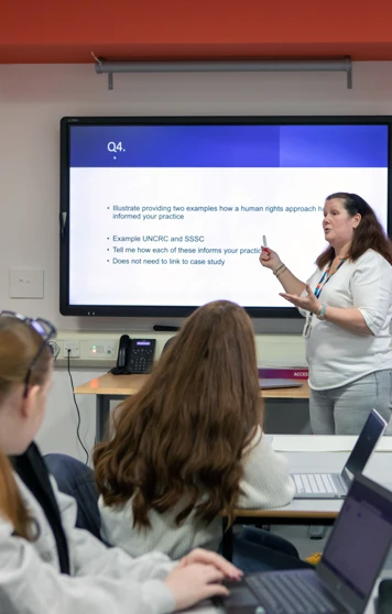 A lecturer at Glasgow Kelvin College leading an engaging discussion with students, exploring human rights approaches in practice. A lecturer at Glasgow Kelvin College leading an engaging discussion with students, exploring human rights approaches in practice.